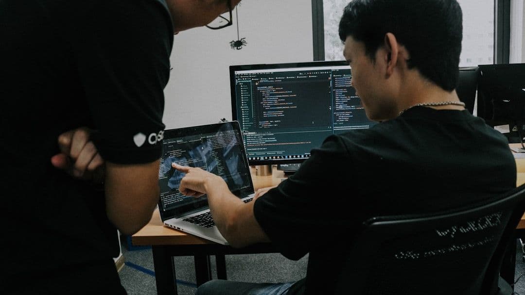 Software engineers collaborating on code review and development
