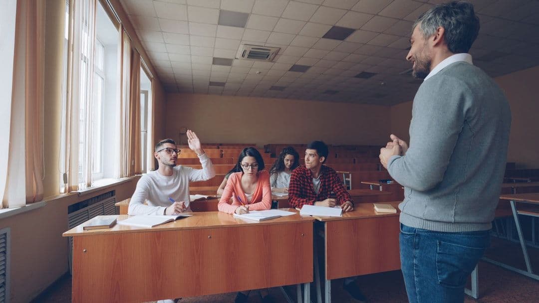 Teacher working with students in a modern classroom setting