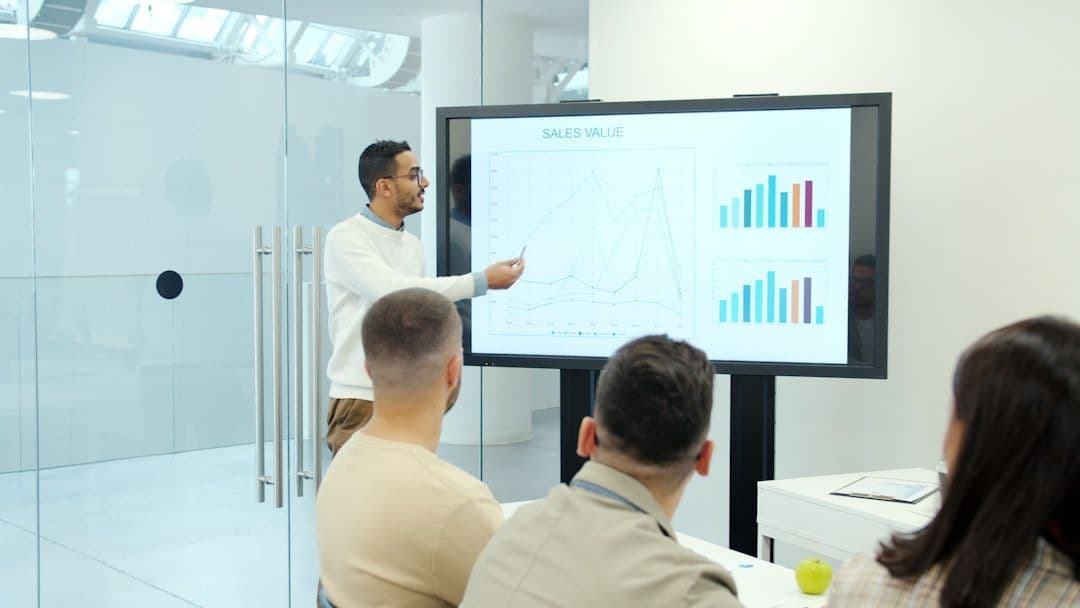 Professional sales team collaborating in modern office setting