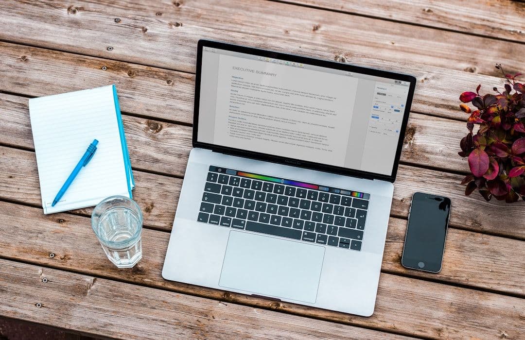 Professional reviewing resume document on computer screen