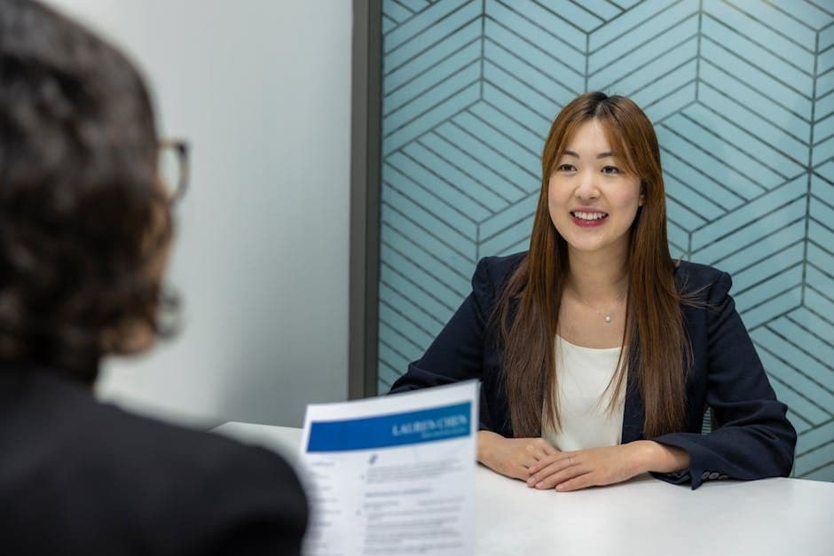 A resume document on a desk being reviewed closely