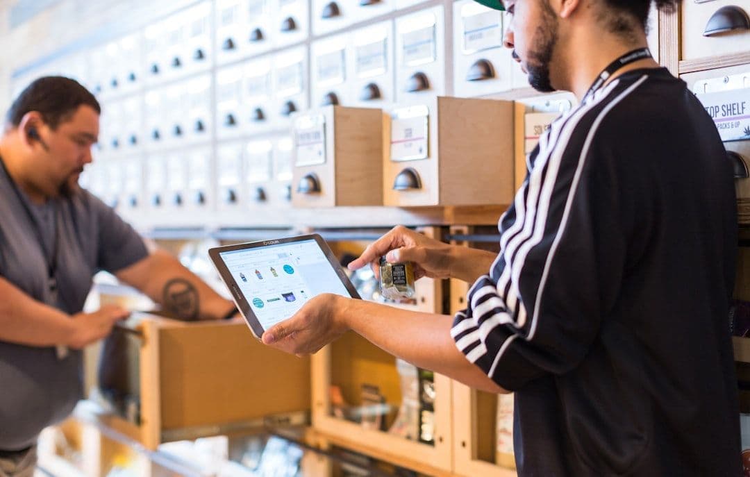 Professional reviewing supply chain analytics on a digital dashboard with charts and metrics