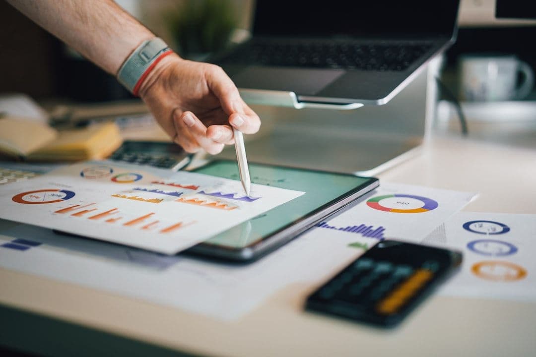 Digital marketing professional analyzing campaign performance on computer dashboard