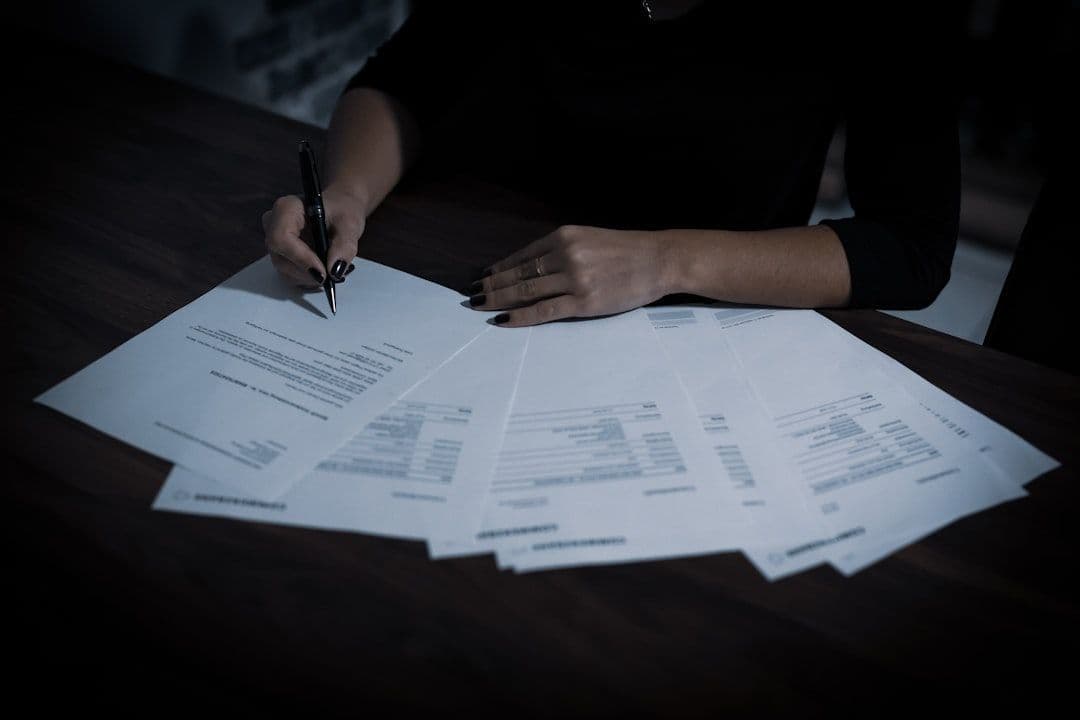 Professional reviewing strategy documents at a desk, planning next career move